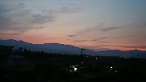 Silhouette mountains against sky at sunset