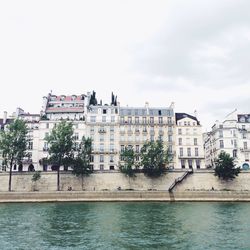 Buildings in city against sky