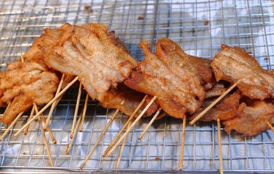 High angle view of meat on barbecue grill