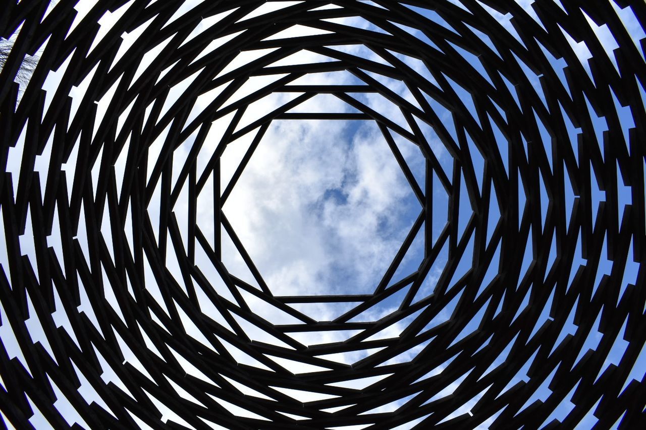 pattern, sky, shape, circle, geometric shape, no people, low angle view, architecture, cloud - sky, design, day, built structure, nature, repetition, spiral, metal, directly below, outdoors, full frame, concentric, skylight, architecture and art, ceiling