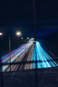 High angle view of light trails on road at night