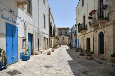 A small street in casamassima, a village with blue-colored houses in the puglia region of italy.