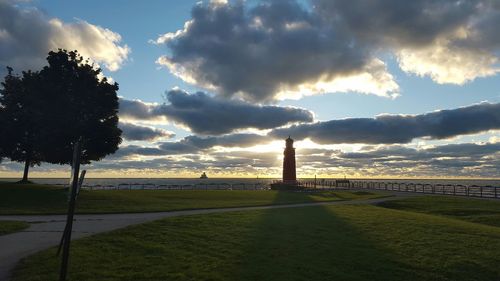 Scenic view of landscape against cloudy sky