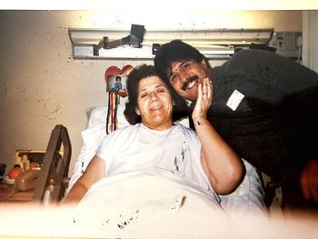 Happy young man sitting at home