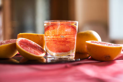 Close-up of orange juice on table