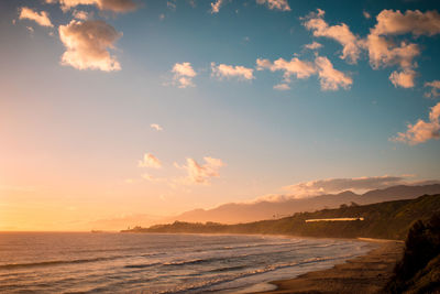 Scenic view of sea against sky at sunset