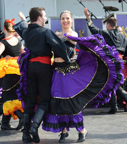 People in traditional clothing dancing