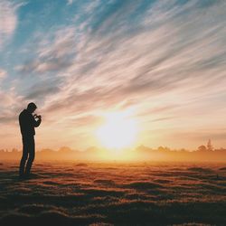 Silhouette of people at sunset