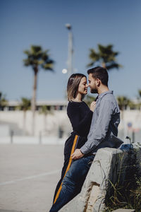 Young couple standing outdoors