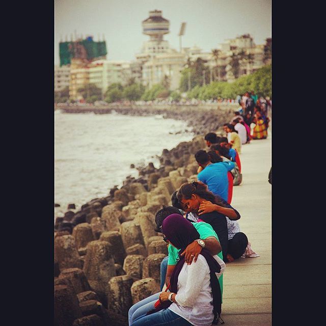 lifestyles, leisure activity, sea, water, men, person, full length, togetherness, rear view, boys, vacations, childhood, tourism, built structure, bonding, tourist, love, architecture