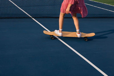 Low section of person playing with ball