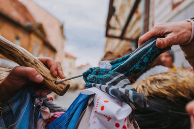 Cropped hand of people holding textile outdoor