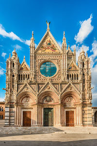 Facade of temple building against sky