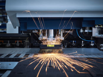 Sparks in automated machinery at factory