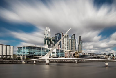 View of bridge over river against buildings