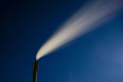 Smoke against blue sky at night