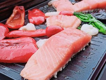 Close-up of salmon and vegetables on barbecue grill