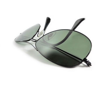 Close-up of sunglasses against white background