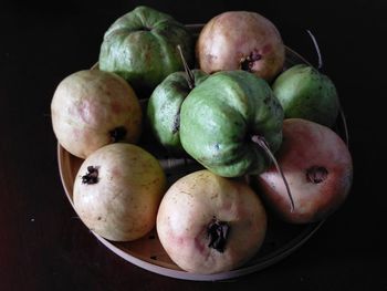 High angle view of apples on table against black background