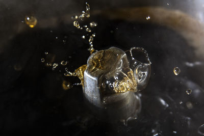 High angle view of water drops on metal