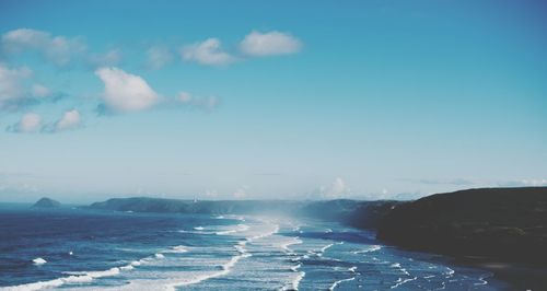 Scenic view of sea against blue sky