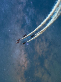 Low angle view of airplane flying against sky