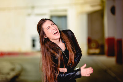 Woman laughing indoors