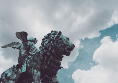 Low angle view of statue against sky