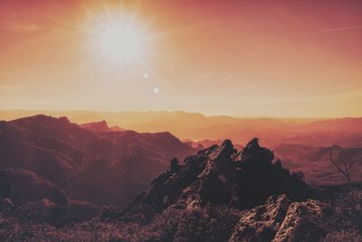 Scenic view of mountains against sky during sunset