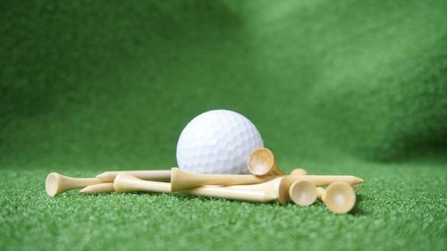 Close-up of golf ball on table