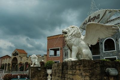 Low angle view of statue of building against sky