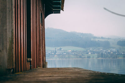 View of lake against buildings in city