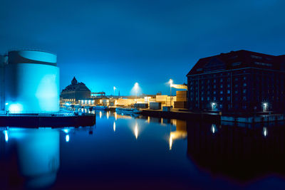 Reflection of buildings in water at night