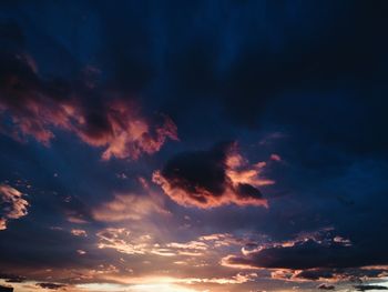 Low angle view of dramatic sky at sunset