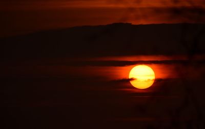 Scenic view of dramatic sky at sunset