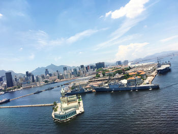 Panoramic view of sea and buildings against sky