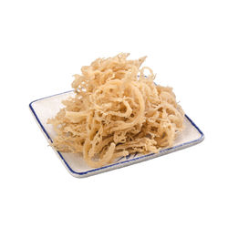 High angle view of bread in plate against white background