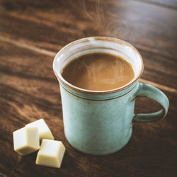 Close-up of coffee cup on table