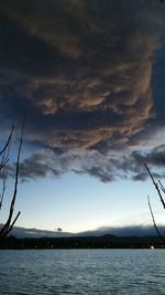 Scenic view of sea against cloudy sky