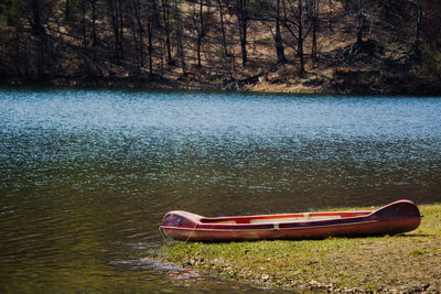 Boat moored on lake