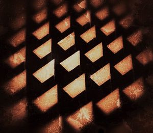 Close-up of shadow on tiled floor