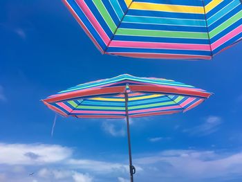 Low angle view of beach umbrella against sky