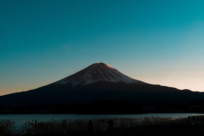 Scenic view of mountains against clear blue sky