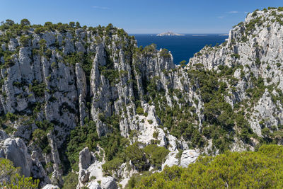 Panoramic view of rocks on land against sky