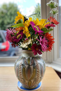 Close-up of flower vase on table