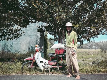 Man riding motorcycle on field