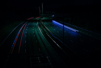 High angle view of light trails on road in city
