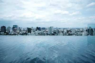 Panoramic view of cityscape against sky during winter