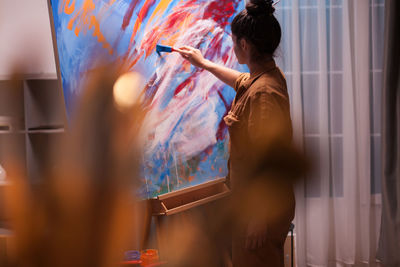 Woman painting at workshop