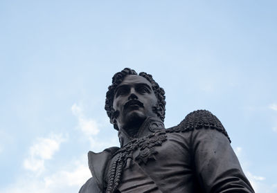 Low angle view of statue against sky